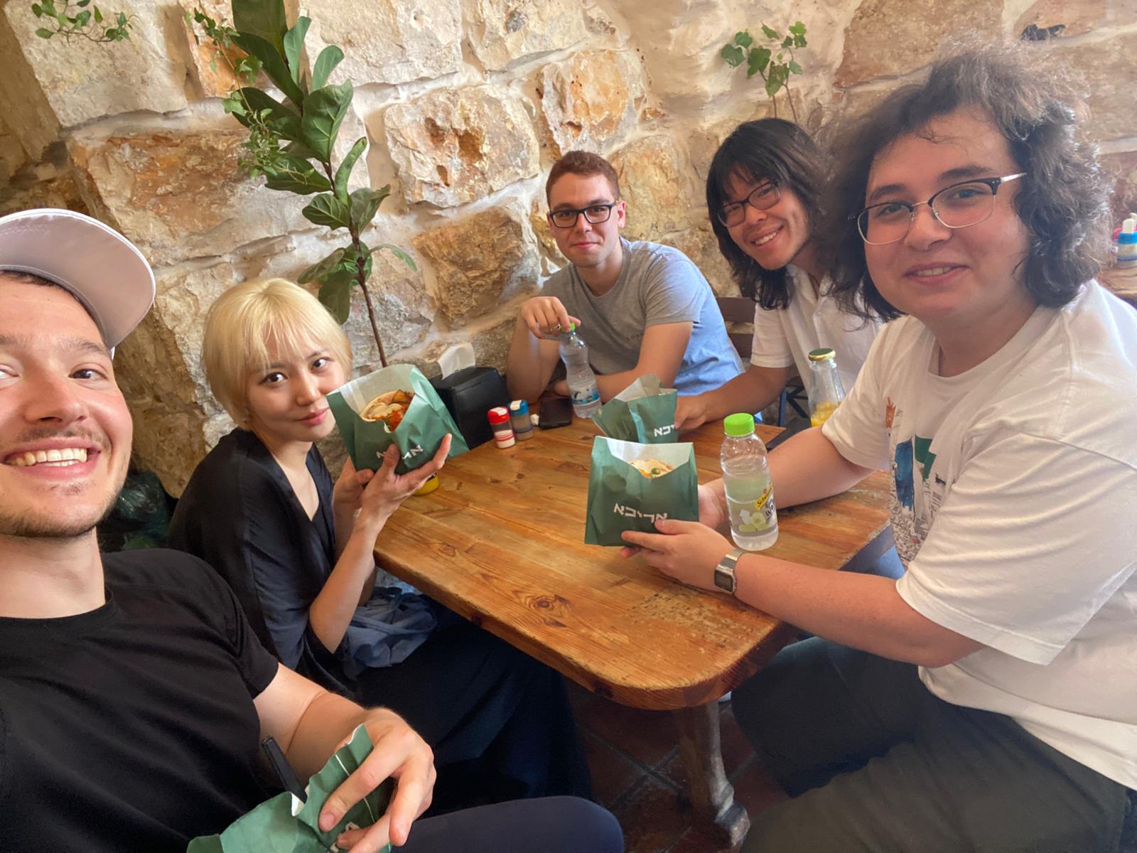Group eating sabich